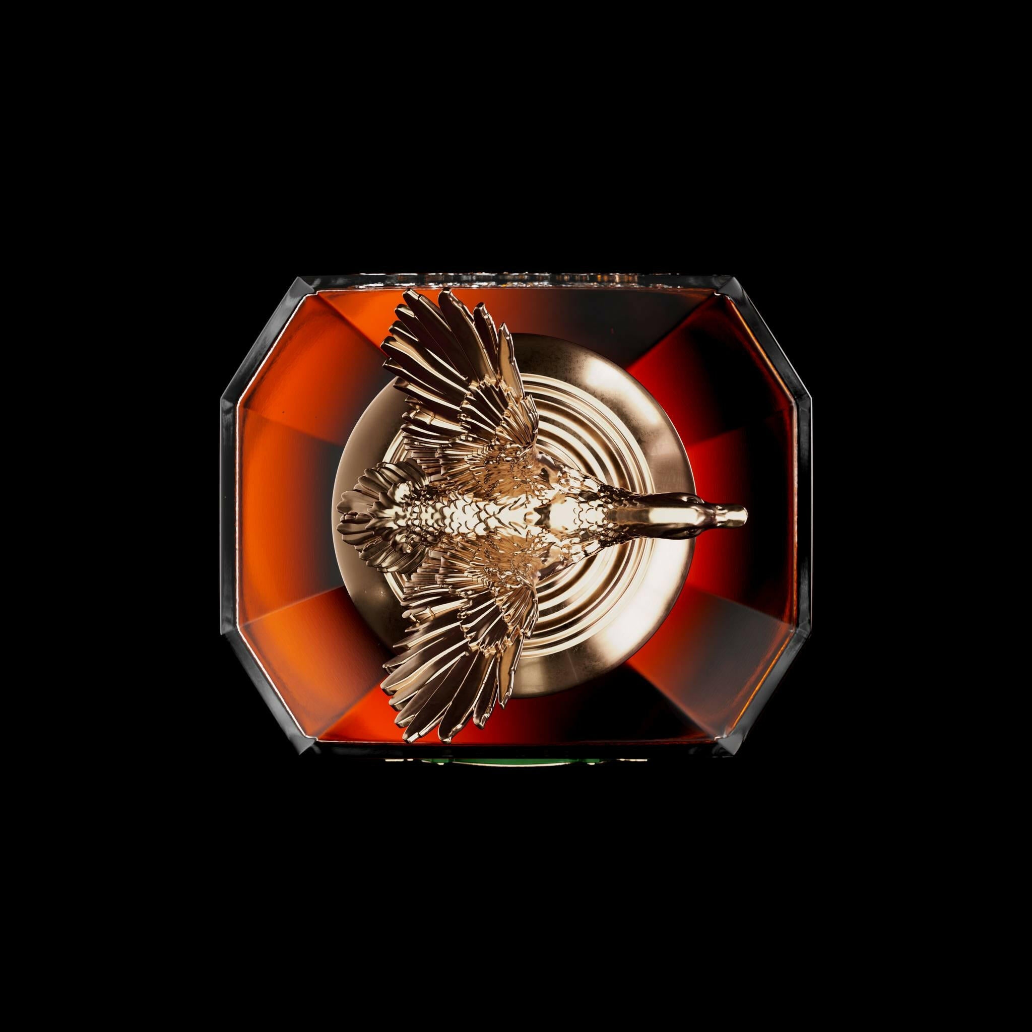 Ducks Unlimited logo overlaying a bottle of premium Kentucky Bourbon celebrating conservation efforts.